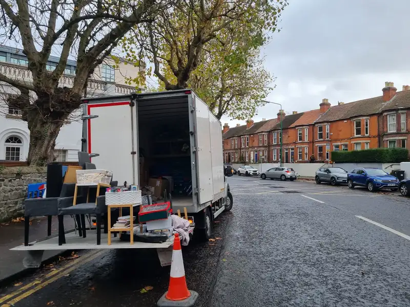 Loading furniture into the Property Clearance truck on a street in Terenure